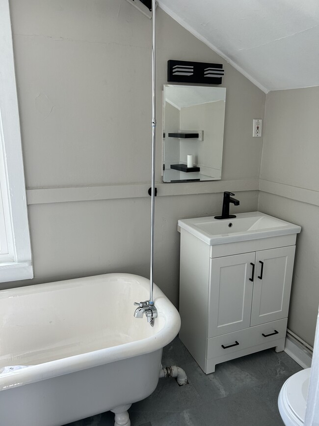 Bathroom with new vanity, refinished original claw foot tub/shower - 2027 Richland Ave