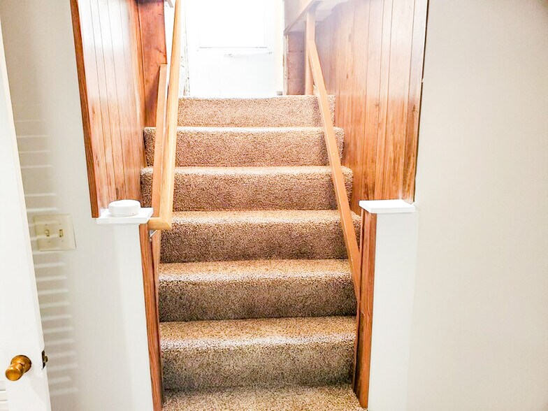 Stairs to unit - 223 E Rose St