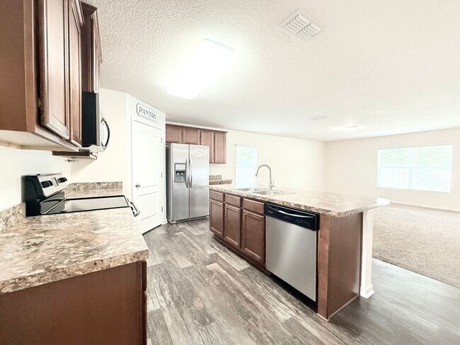 Building Photo - Spacious 4BR Home with Large Fenced Yard & Community Pool