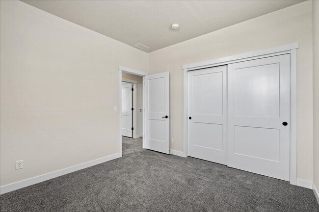 Building Photo - Brand New, Stylish 4-Bedroom Home with Vaulted Ceilings and Private Patio