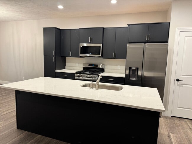 Building Photo - New Construction! West side location. 4br, 3bth, 2crg, Finished basement. All new stainless steel...