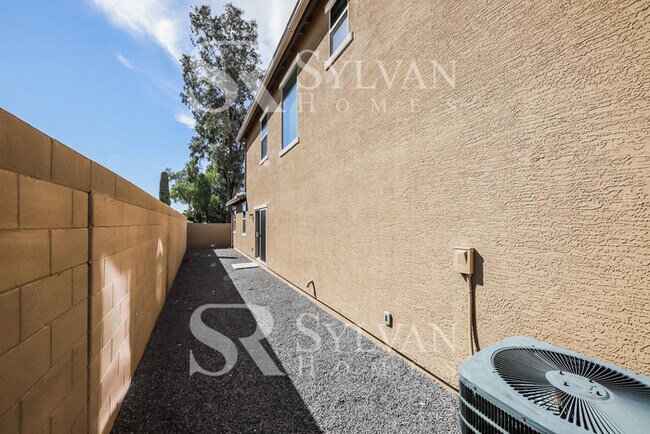 Building Photo - This home exudes a cheerful and welcoming charm!