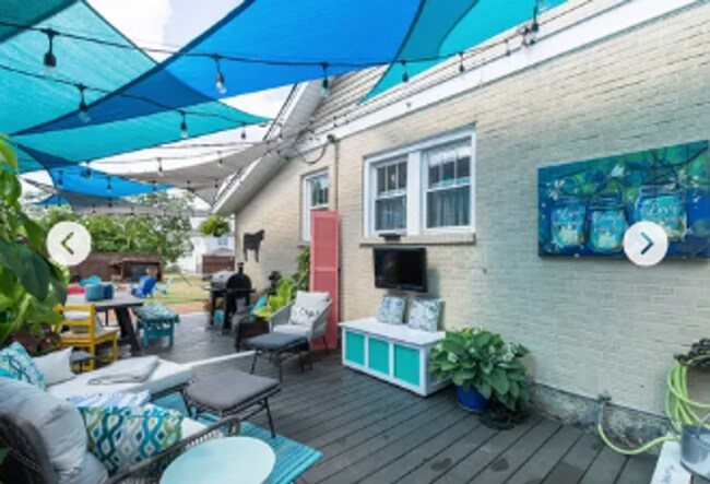 Building Photo - 4 Bedroom with a Hot Tub in the heart of t...