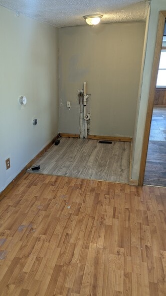 bedroom with laundry area - 24 Mechanic St