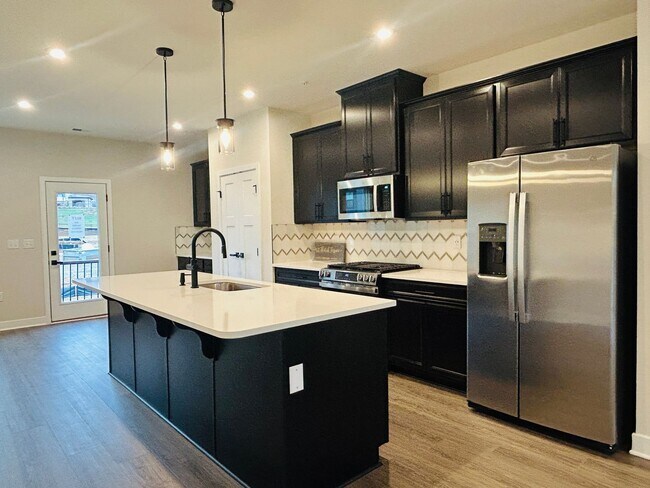 Building Photo - New Construction • 4 BR • 2 Full / 2 Half BA • End Unit Townhome in Village Town – Fayetteville’s...