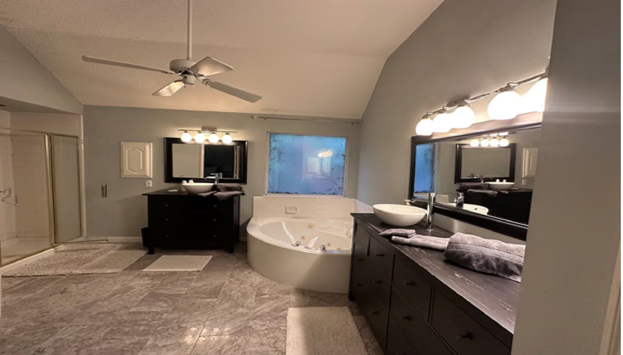 Serene primary suite, dual vanities, a glass shower, whirlpool tub, private bath - 10913 Alexandria Dr