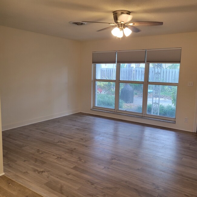 living room with new fan/light fixture - 2031 NE 56th St