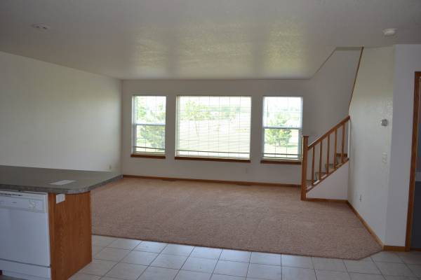 living room windows and stair case - 610 N Aspen Ct