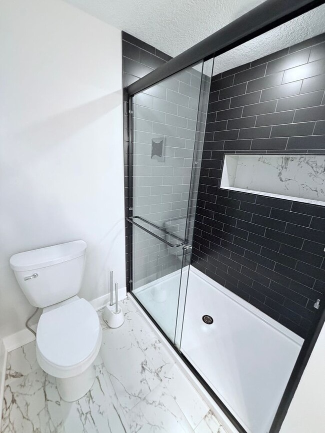 Building Photo - Spacious 4-Bedroom Home with Pond Views & EV-Ready Garage – Bloomington!!