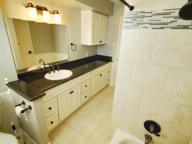 Extra large counter and storage space in this hallway bathroom. - 37438 Meadowview Dr