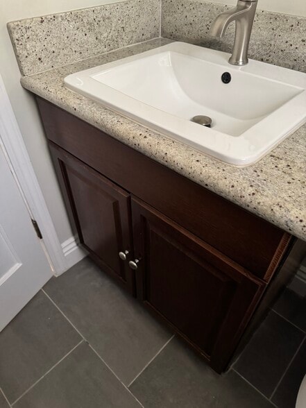 BATHROOM SINK AND CABINET - 6247 Oak Crest Way
