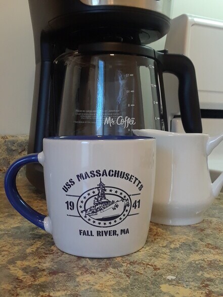 Kitchen is fully stocked with microwave, toaster, Keurig, dishes, and pots and pans. - 56 Fulton St