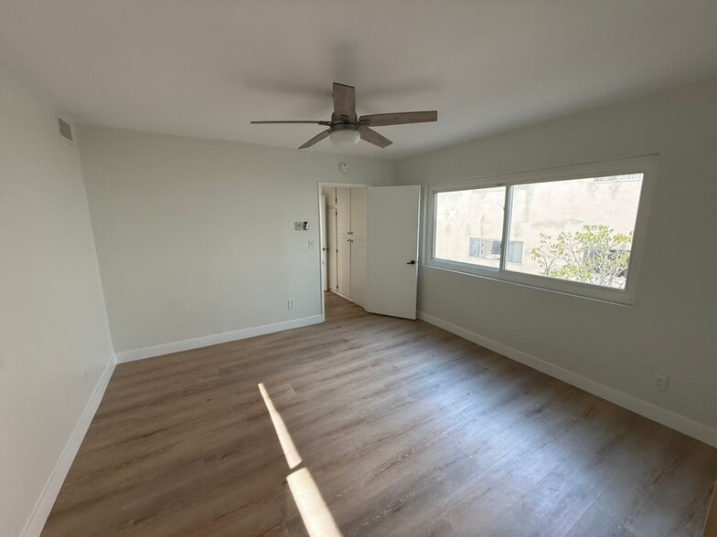 Primary bedroom with large window, large closet and an additional full size hallway closet!closet - 1203 N Sweetzer Ave