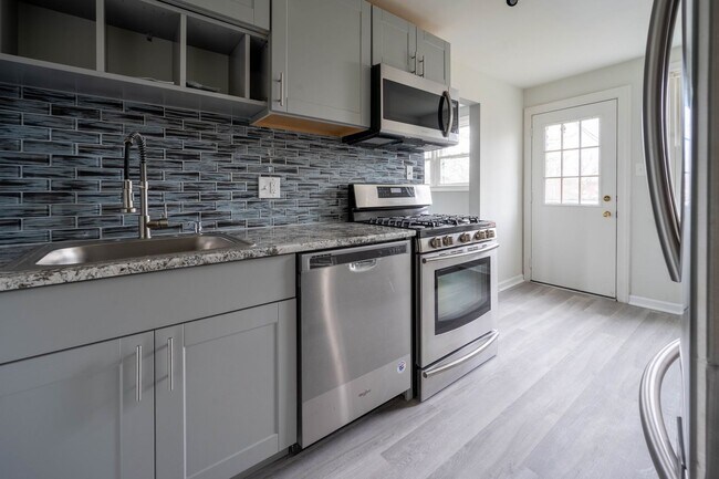 Building Photo - Twin Brick Home in Ridley SD! Granite and stainless kitchen! Renovated bathroom! Large rear fence...