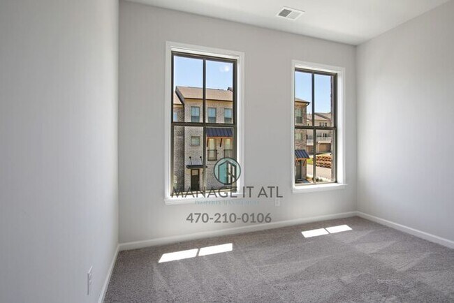 Building Photo - Modern 3-level Townhome featuring 4 bedrooms and 3 1/2 baths