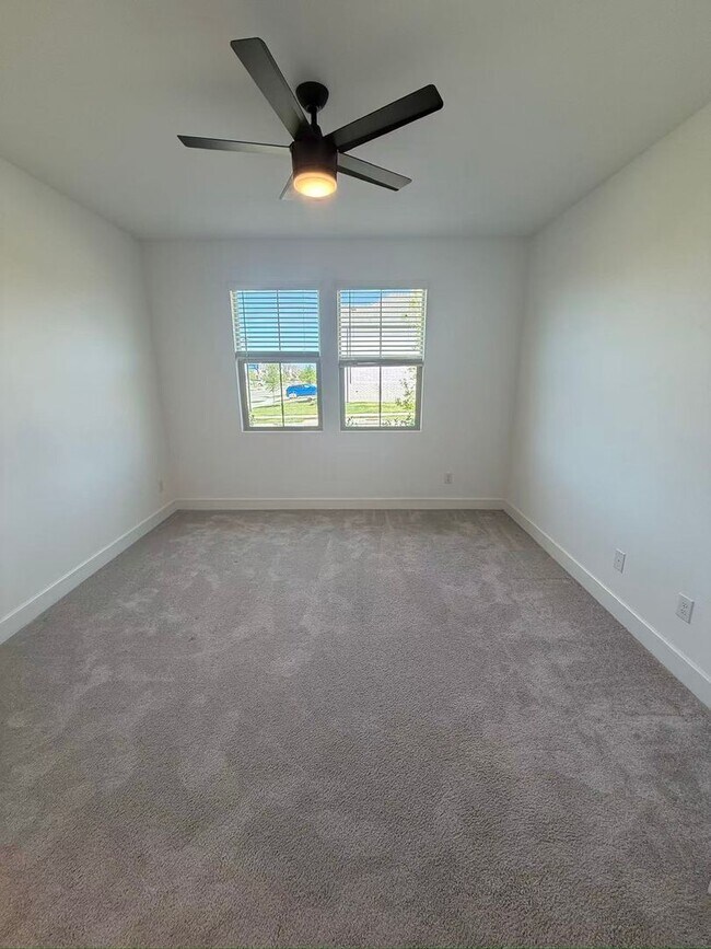 Building Photo - Move-in ready and like-new! Washer, dryer, and refrigerator Included.