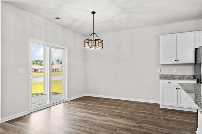 Building Photo - Modern 4BR Home with Screened Porch & Pond Views | Sun Colony, Longs SC