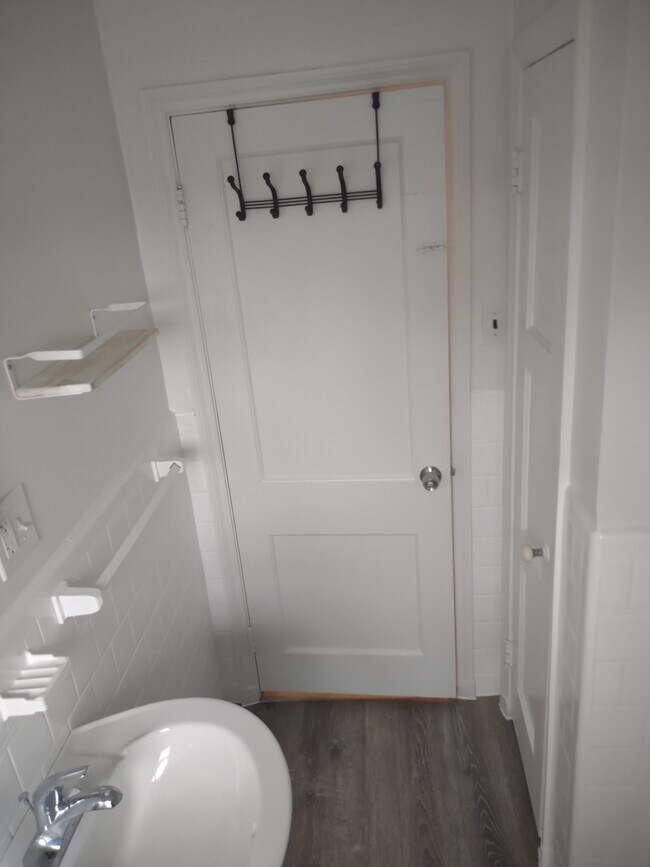 Bathroom shelf and towel rack - 1929 E Belvedere Ave