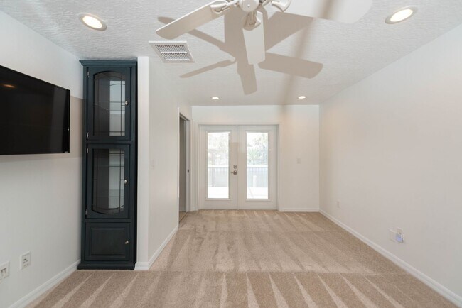 Building Photo - Live the ultimate Space Coast waterfront lifestyle at this stunning beachside canal home in Satel...