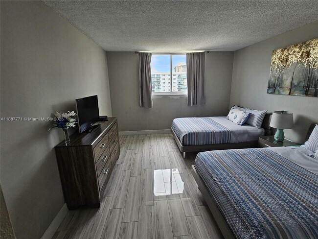 Building Photo - 19370 Collins Ave