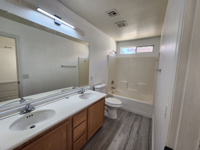Building Photo - Sleek 2 story home with tile in most living areas and upgraded kitchen.