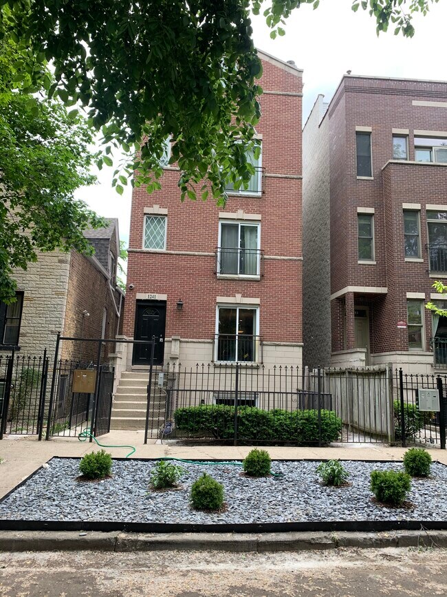 Building front with locked gate - 1241 N Maplewood Ave