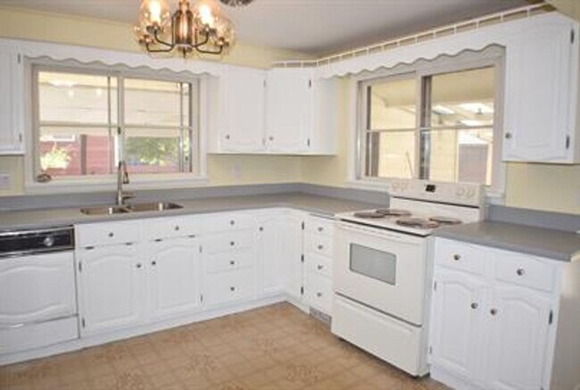 Building Photo - Updated house with original hardwoods and 2-car garage!