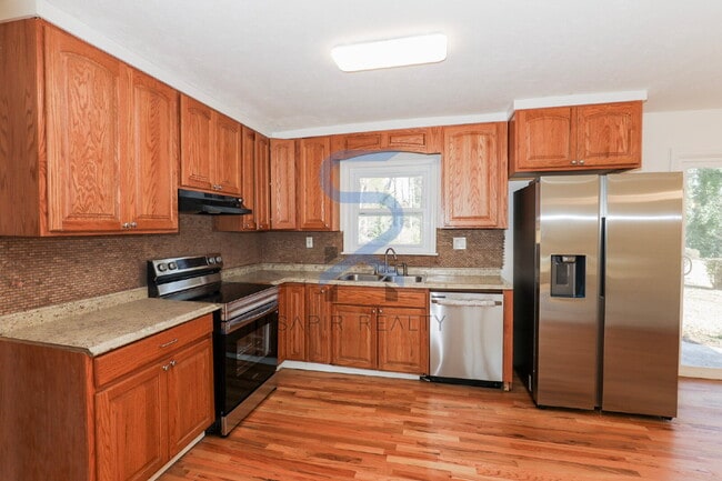 Building Photo - Move in before February 28th and choose your reward: a $250 Amazon Gift Card or a 55" Smart TV!