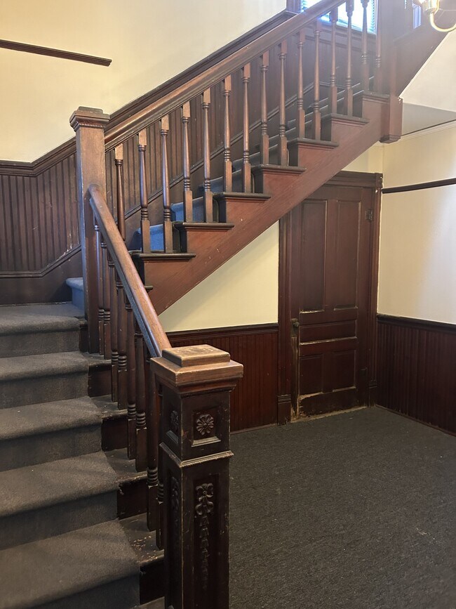 Staircase in foyer leading to second floor apartment. - 1118 25th St