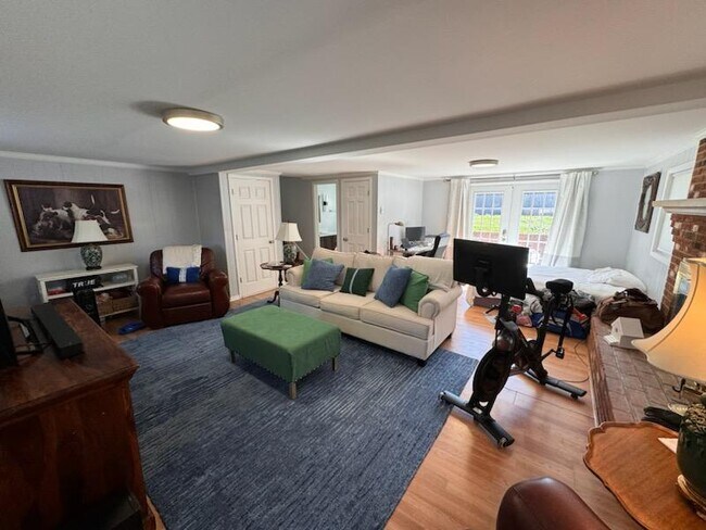 Downstairs large family room fireplace and walkout patio - 1105 Golfview Dr