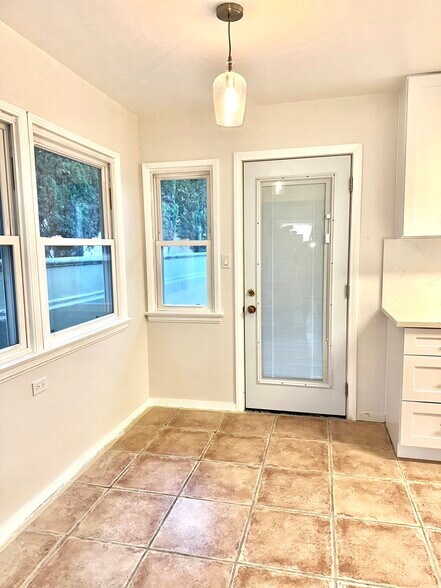 Breakfast nook with back door to private patio - 1033 Pearl St
