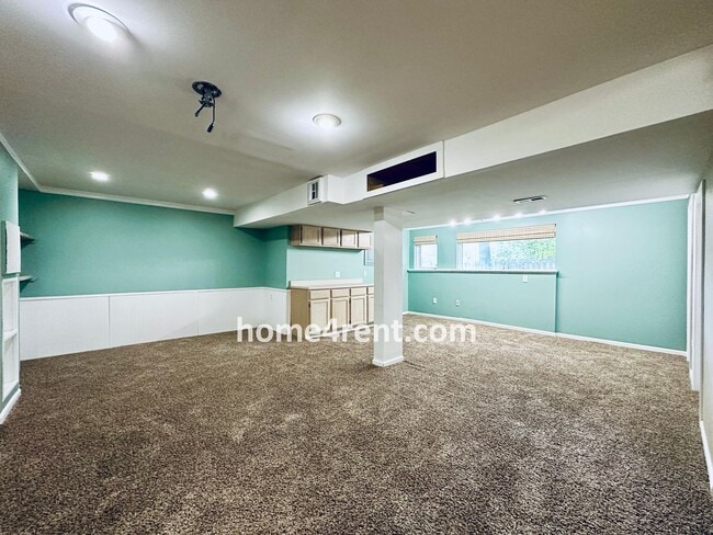 Building Photo - Blue Valley Schools w/ Wood Floors, Finished Basement and a Peaceful, Private Fenced Yard!