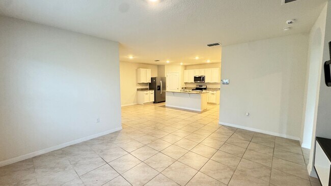 Building Photo - Available NOW! Spacious 4BD/2BA Haven in Villages at Harmony – Your Dream Home Awaits! WASHER & D...