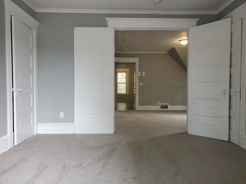 Two large closets on each side of front bedroom. - 1915 Johnson St NE