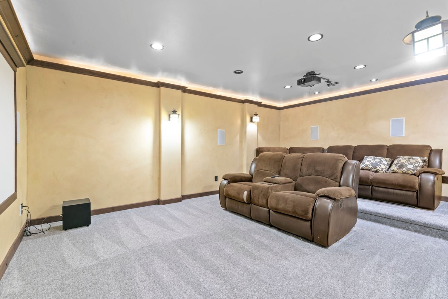 Couches in theater room to stay - 231 E Sunshine Dr