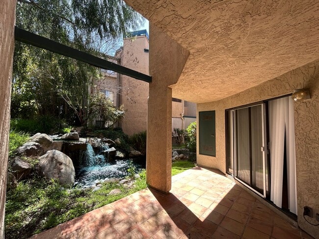 Building Photo - One Bedroom with Garage and IN-Unit laundry in Resort-Style Complex
