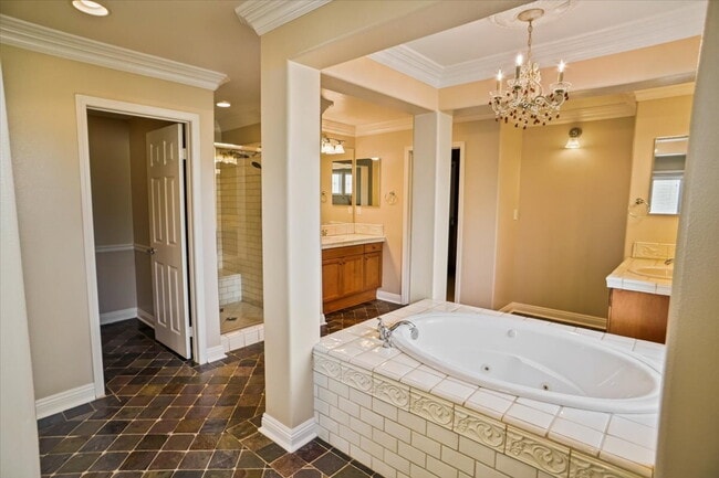 Building Photo - "Spacious 4-Bedroom Retreat with Cozy Fire...