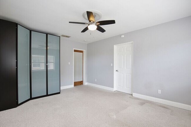 Building Photo - Gorgeous Waterfront 3/2 Mid-century Modern Style Home with a Covered Patio and a Large Backyard i...