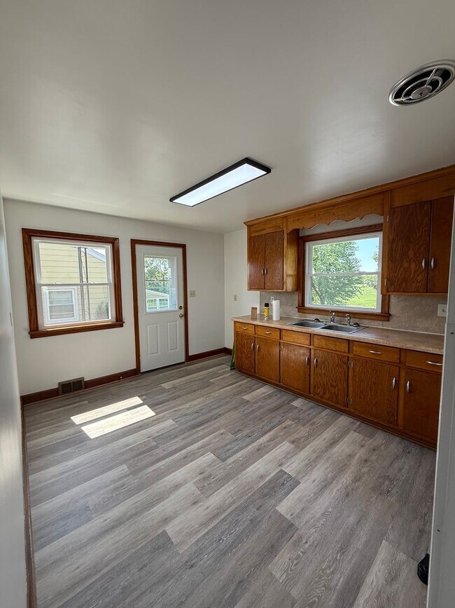 Building Photo - Charming 4-Bedroom Cape Cod Home with Spacious Yard & Storage