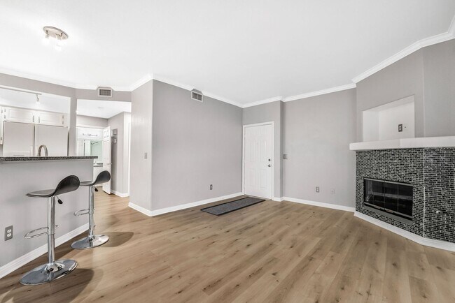 Building Photo - Light-Filled Dual-Suite Condo with Soaring Ceilings, Fireplace & Private Balcony in Amenity-Rich ...