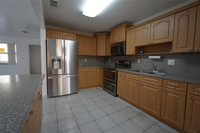 Building Photo - 6380 W 24th Ct