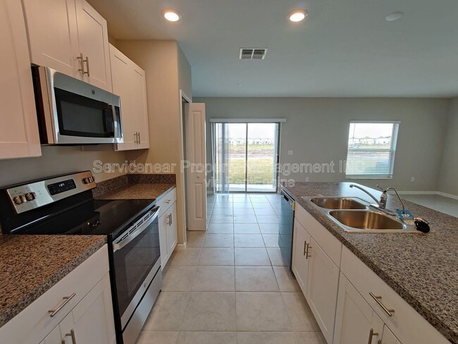 Building Photo - 7412 French Marigold Ave.