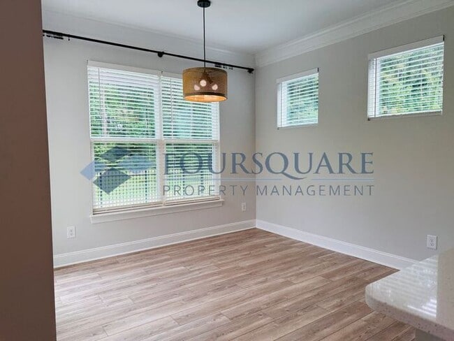 Building Photo - End-Unit Townhome with Fenced Yard, Washer/Dryer included & 2-Car Garage – Comfortable & Convenie...
