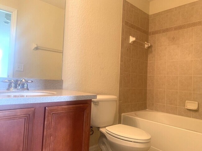 Building Photo - GATED COMMUNITY WITH COMMUNITY POOL