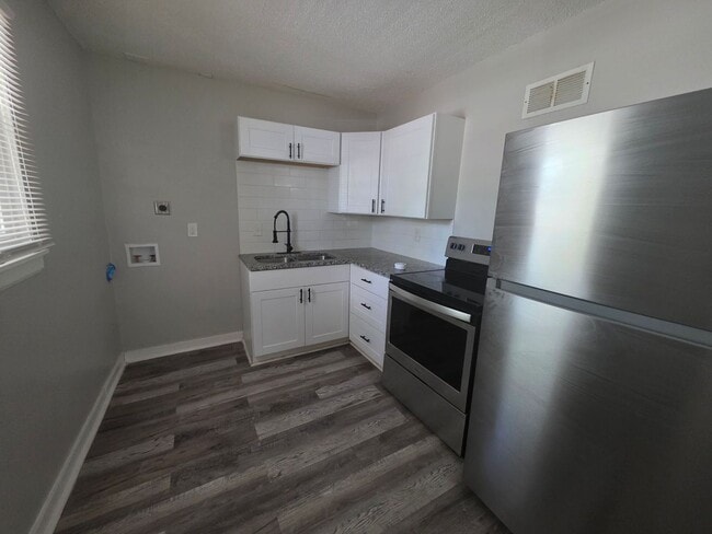 Building Photo - Coming Soon: Charming & Light-Filled 2-Bedroom Duplex!