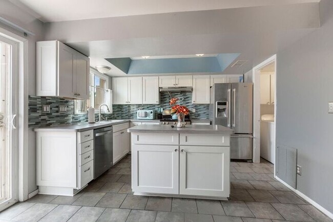 Building Photo - Discover this charming two-story townhome