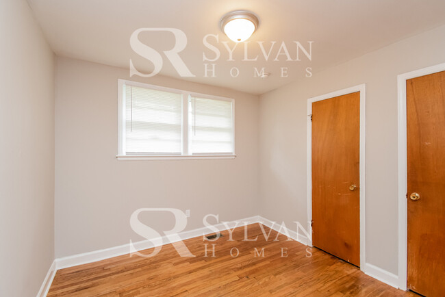 Building Photo - Welcome to this charming abode.