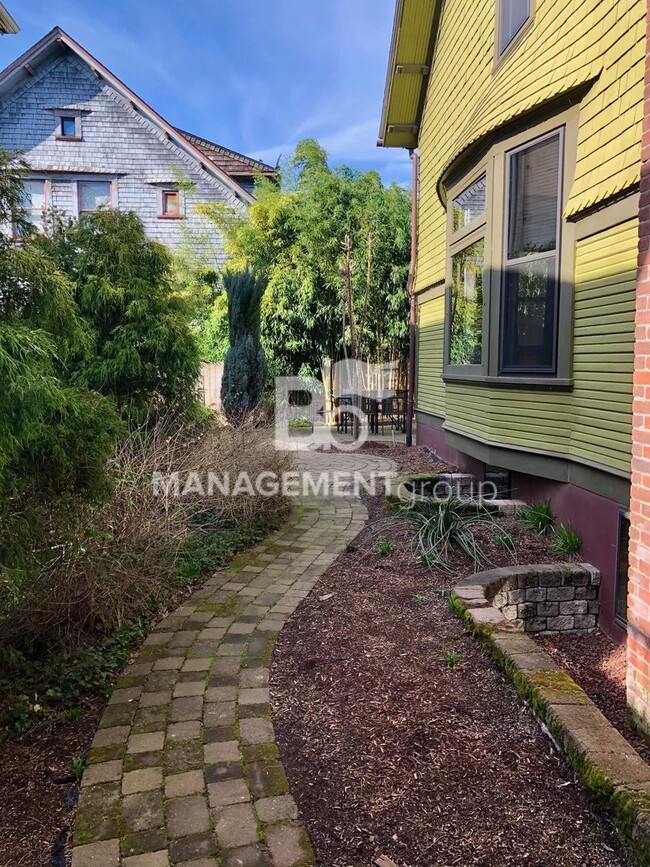 Building Photo - Close-In NE Portland Victorian Offers  Perfect Blend of  Old Charm with Newer Amenities. Lush Pri...