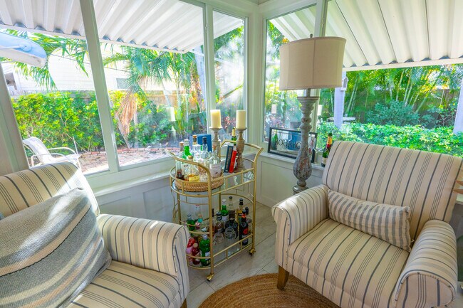 lovely sitting area impact windows - 1517 N Palmway