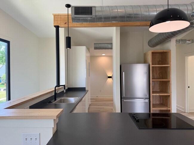 Building Photo - Vaulted Ceilings & Hardwood Floors in This Charming Indianapolis L